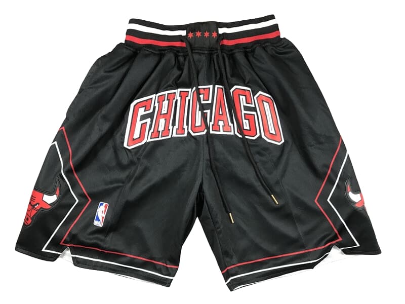 Front view of Chicago Bulls Black Statement Swingman Shorts featuring a sleek black design with the Bulls logo and statement edition details.